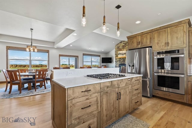 3483 Highline Rd, Manhattan, MT 59741 - kitchen with stainless steel appliances, light wood-style floors, plenty of natural light, vaulted ceiling, and recessed lighting