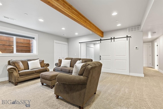 3483 Highline Rd, Manhattan, MT 59741 - living area featuring a barn door, light colored carpet, recessed lighting, beam ceiling, and baseboards