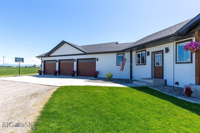 3483 Highline Rd, Manhattan, MT 59741 - ranch-style home featuring driveway, a front yard, a garage, and roof with shingles