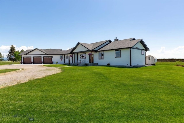 3483 Highline Rd, Manhattan, MT 59741 - ranch-style house featuring driveway, an attached garage, a front yard, and a chimney