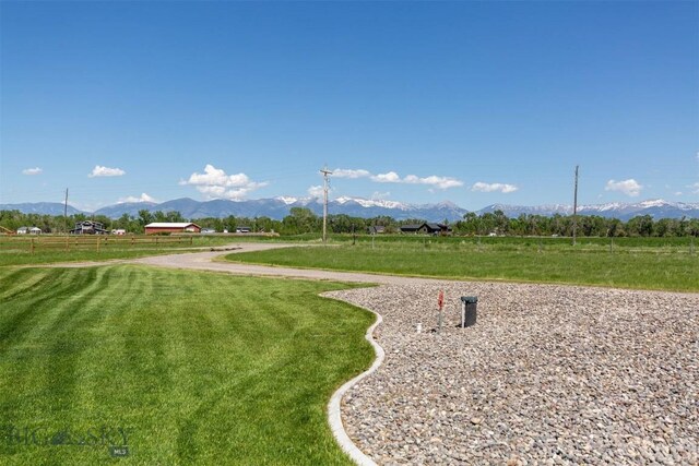 3483 Highline Rd, Manhattan, MT 59741 - surrounding community featuring a mountain view, a lawn, and a view of countryside