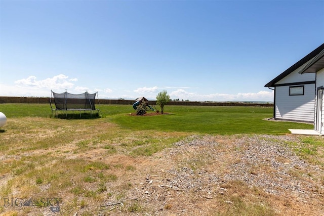3483 Highline Rd, Manhattan, MT 59741 - view of green lawn featuring a trampoline