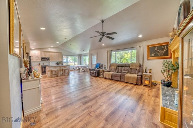 118 Clinton, Belgrade, MT 59714 - living area featuring lofted ceiling, light wood-type flooring, ceiling fan, and recessed lighting