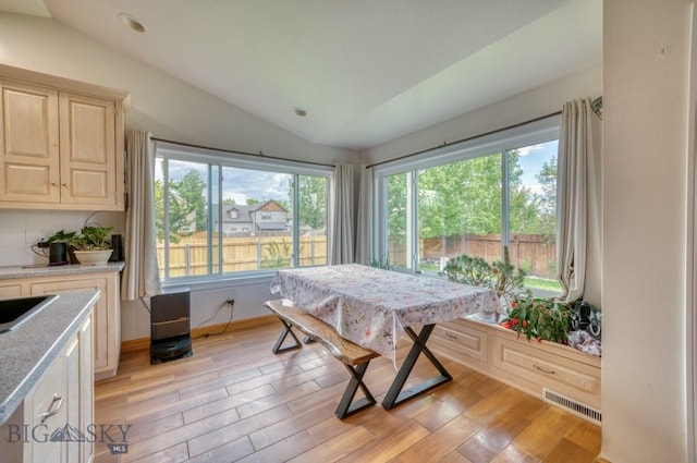 118 Clinton, Belgrade, MT 59714 - dining room with vaulted ceiling and light wood-style floors