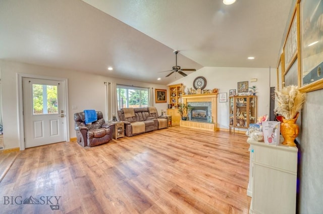 118 Clinton, Belgrade, MT 59714 - living room with a high end fireplace, a ceiling fan, light wood-type flooring, lofted ceiling, and recessed lighting