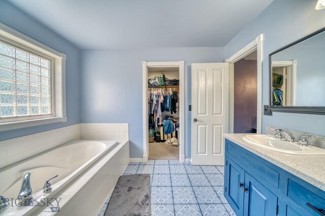 118 Clinton, Belgrade, MT 59714 - bathroom with a garden tub, vanity, and a walk in closet