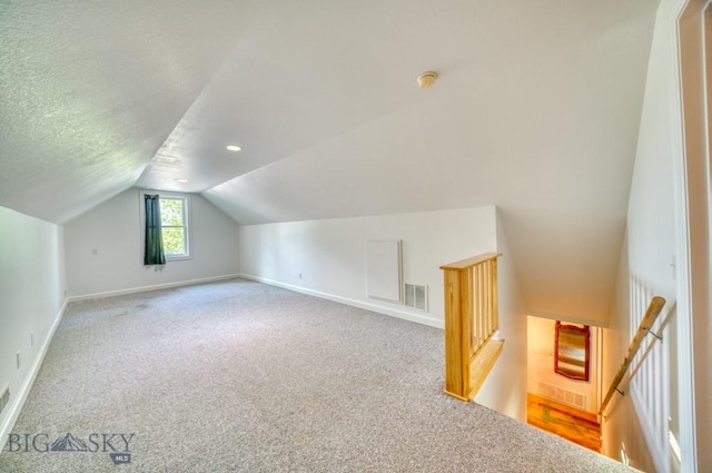 118 Clinton, Belgrade, MT 59714 - additional living space with lofted ceiling and carpet flooring