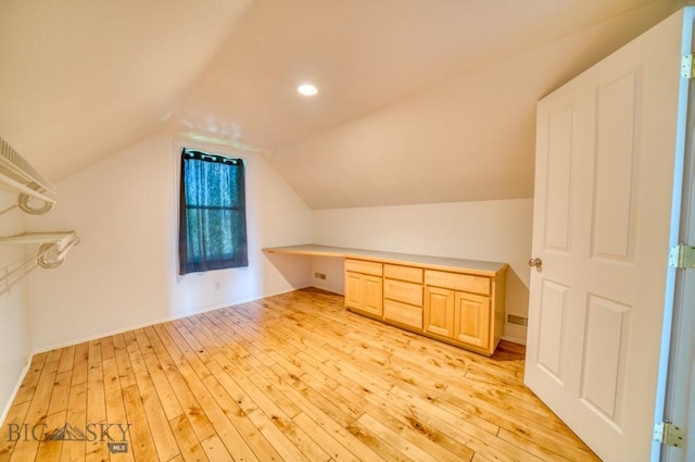 118 Clinton, Belgrade, MT 59714 - bonus room featuring light wood-style floors, built in desk, lofted ceiling, and recessed lighting