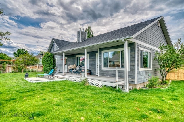 118 Clinton, Belgrade, MT 59714 - back of house featuring a chimney and roof with shingles
