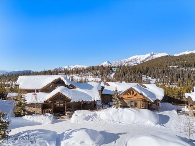 18 Upper Cascade Ridge Rd Unit 18, Big Sky, MT 59716 - snowy aerial view featuring a mountain view