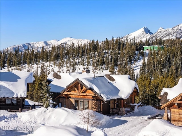 18 Upper Cascade Ridge Rd Unit 18, Big Sky, MT 59716 - snowy aerial view featuring a mountain view
