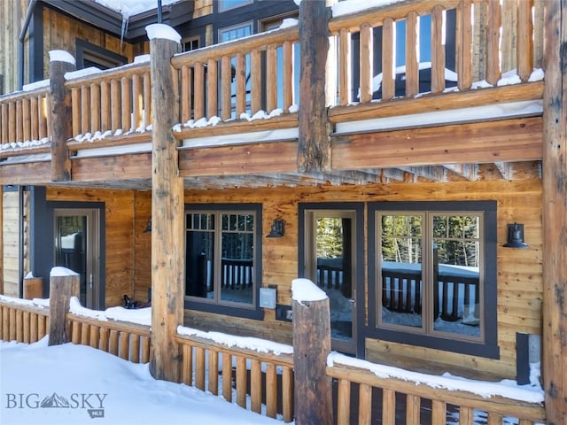 18 Upper Cascade Ridge Rd Unit 18, Big Sky, MT 59716 - snow covered property entrance with a balcony