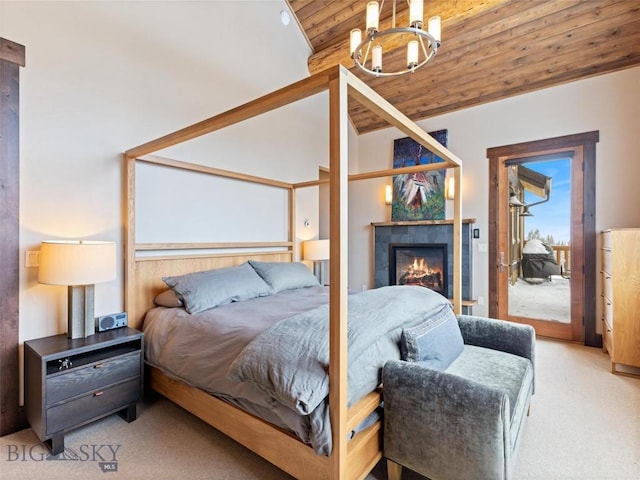 18 Upper Cascade Ridge Rd Unit 18, Big Sky, MT 59716 - bedroom with wood ceiling, light colored carpet, access to outside, and a tile fireplace