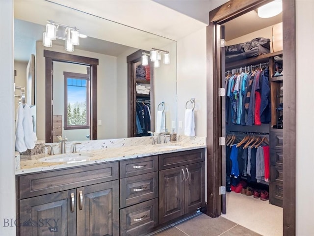 18 Upper Cascade Ridge Rd Unit 18, Big Sky, MT 59716 - bathroom with double vanity, a walk in closet, and tile patterned floors