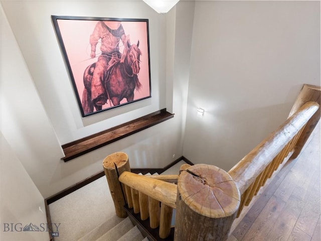 18 Upper Cascade Ridge Rd Unit 18, Big Sky, MT 59716 - staircase featuring wood finished floors and baseboards