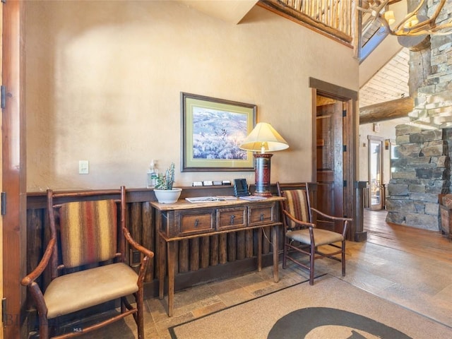 18 Upper Cascade Ridge Rd Unit 18, Big Sky, MT 59716 - sitting room featuring wainscoting and a high ceiling