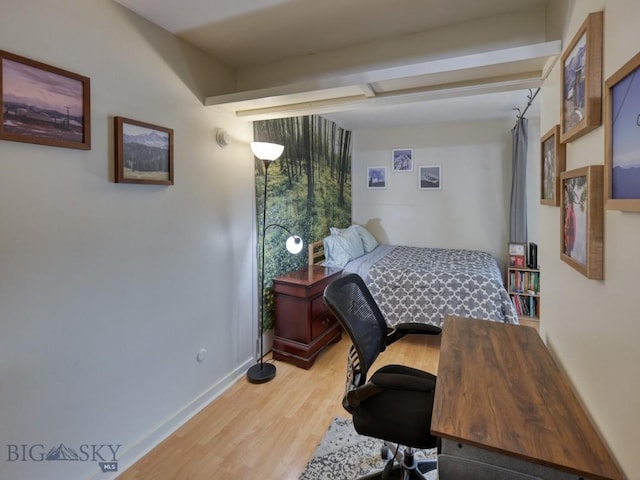 21 Sitting Bull Unit 1220, Big Sky, MT 59716 - bedroom with light wood-style floors, an office area, and baseboards