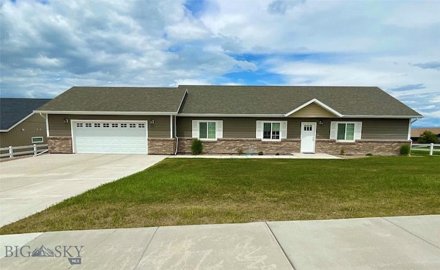 121 Ridge Ct, Dillon, MT 59725 - view of front of home featuring driveway, a garage, brick siding, and roof with shingles
