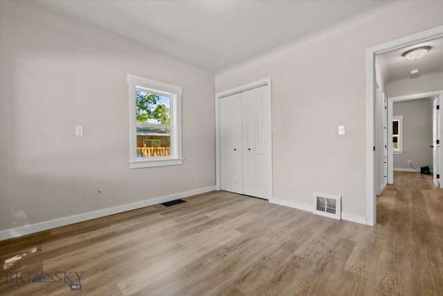643 Parkhill, Billings, MT 59102 - unfurnished bedroom featuring wood finished floors, baseboards, and a closet