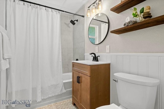 643 Parkhill, Billings, MT 59102 - full bath with vanity, shower / bath combo with shower curtain, toilet, and wainscoting