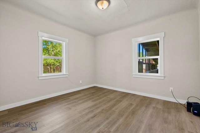 643 Parkhill, Billings, MT 59102 - spare room featuring baseboards and wood finished floors