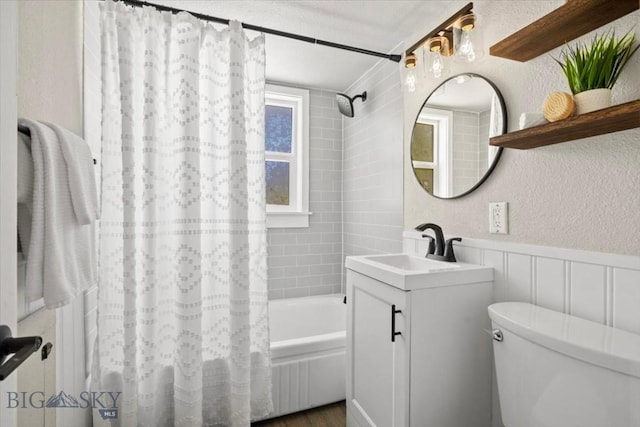 643 Parkhill, Billings, MT 59102 - full bathroom with vanity, shower / bathtub combination with curtain, toilet, a textured wall, and wainscoting