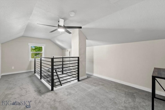 643 Parkhill, Billings, MT 59102 - bonus room with lofted ceiling, a textured ceiling, baseboards, carpet, and a ceiling fan