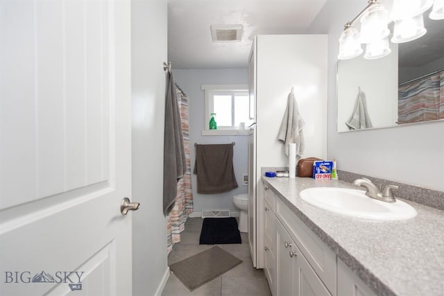 504 N 19th Ave, Bozeman, MT 59718 - bathroom featuring vanity, toilet, tile patterned floors, and a shower with curtain