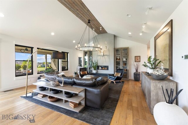 646 Arrow Trl, Bozeman, MT 59718 - living room featuring light wood finished floors, baseboards, a chandelier, and recessed lighting
