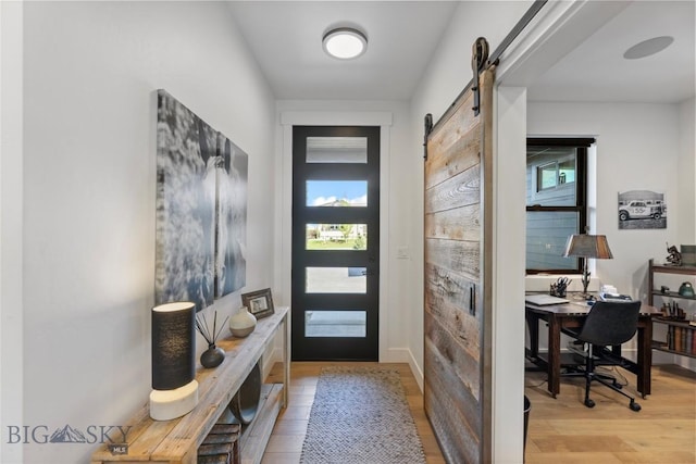 646 Arrow Trl, Bozeman, MT 59718 - foyer entrance with light wood-type flooring and a barn door