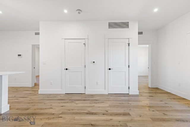 1704 W Lincoln Unit 5B, Bozeman, MT 59715 - unfurnished bedroom with light wood-type flooring and recessed lighting