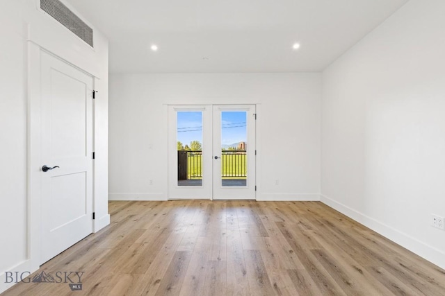 1704 W Lincoln Unit 5B, Bozeman, MT 59715 - empty room with baseboards, light wood finished floors, recessed lighting, and french doors