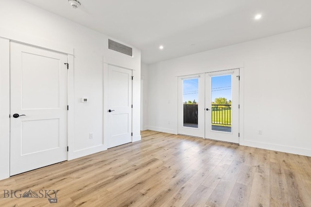1704 W Lincoln Unit 5B, Bozeman, MT 59715 - unfurnished bedroom featuring access to exterior, light wood finished floors, baseboards, recessed lighting, and french doors