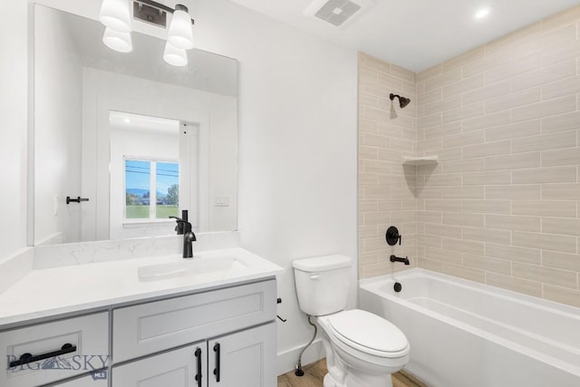 1704 W Lincoln Unit 5B, Bozeman, MT 59715 - bathroom featuring vanity, toilet, bathing tub / shower combination, and wood finished floors