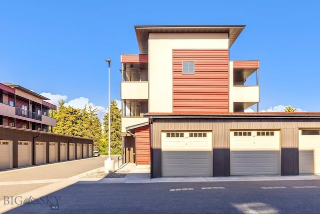 1704 W Lincoln Unit 5B, Bozeman, MT 59715 - view of front of house with community garages and a balcony
