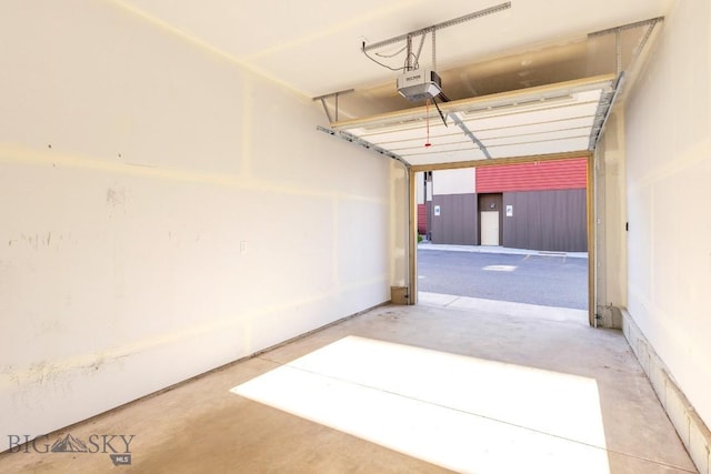 1704 W Lincoln Unit 5B, Bozeman, MT 59715 - garage featuring a garage door opener