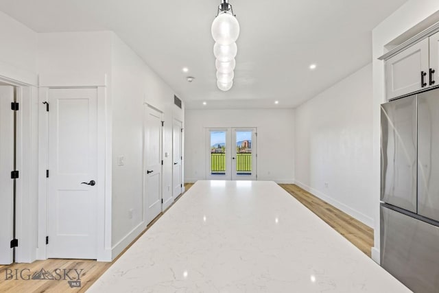 1704 W Lincoln Unit 5B, Bozeman, MT 59715 - hallway featuring french doors, light wood-style floors, baseboards, and recessed lighting