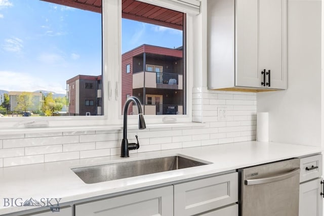 1704 W Lincoln Unit 5B, Bozeman, MT 59715 - kitchen featuring dishwasher, decorative backsplash, light countertops, and healthy amount of natural light