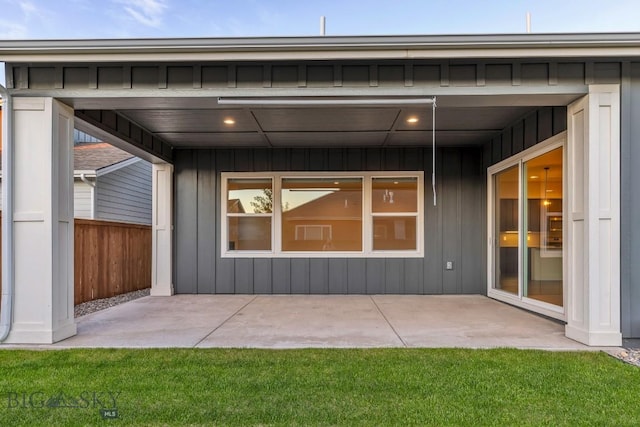 1609 Wyatt Earp Ct, Belgrade, MT 59714 - rear view of property with a patio area and board and batten siding