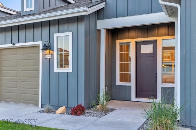 1609 Wyatt Earp Ct, Belgrade, MT 59714 - doorway to property featuring board and batten siding, roof with shingles, and a garage
