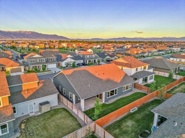 1609 Wyatt Earp Ct, Belgrade, MT 59714 - aerial view at dusk of a residential view and a mountain view