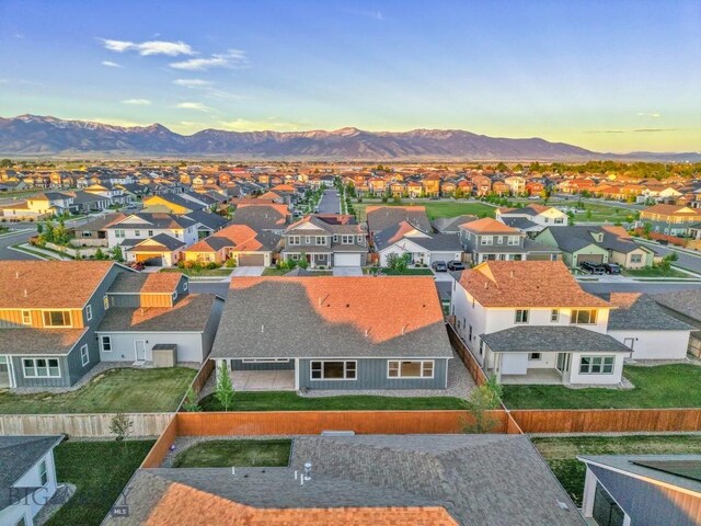 1609 Wyatt Earp Ct, Belgrade, MT 59714 - aerial view at dusk of a residential view and a mountain view