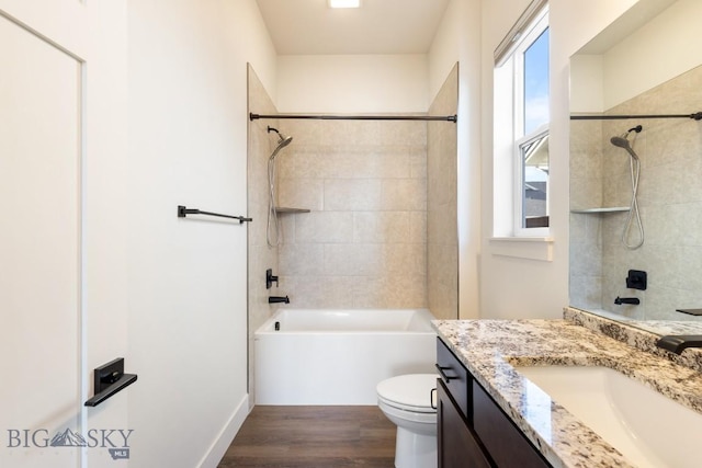 1609 Wyatt Earp Ct, Belgrade, MT 59714 - full bathroom with vanity, bathing tub / shower combination, wood finished floors, and toilet