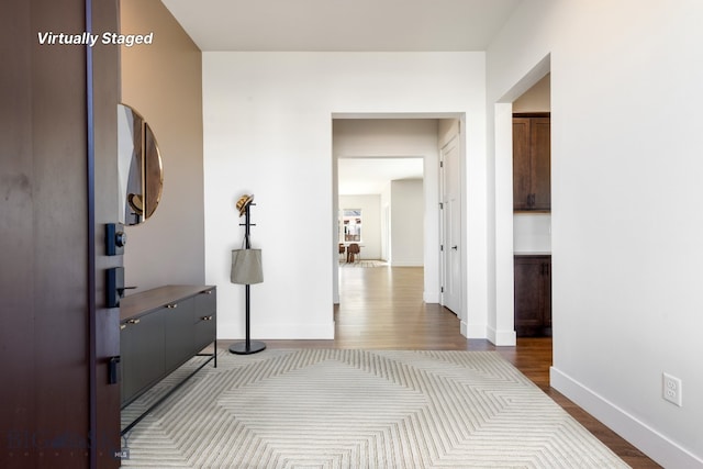 1609 Wyatt Earp Ct, Belgrade, MT 59714 - hall featuring dark wood-style flooring and baseboards