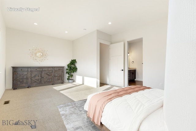 1609 Wyatt Earp Ct, Belgrade, MT 59714 - bedroom featuring carpet floors, recessed lighting, and ensuite bathroom