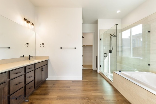 1609 Wyatt Earp Ct, Belgrade, MT 59714 - full bathroom featuring vanity, a stall shower, a garden tub, and healthy amount of natural light