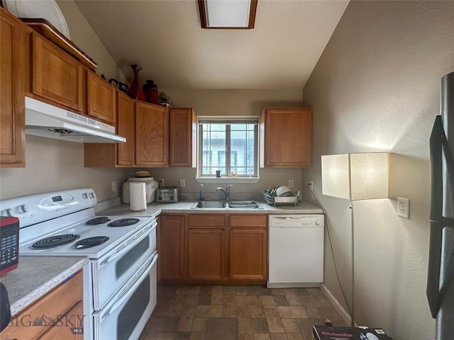 4442 Alexander, Bozeman, MT 59718 - kitchen with white appliances, under cabinet range hood, a sink, and light countertops