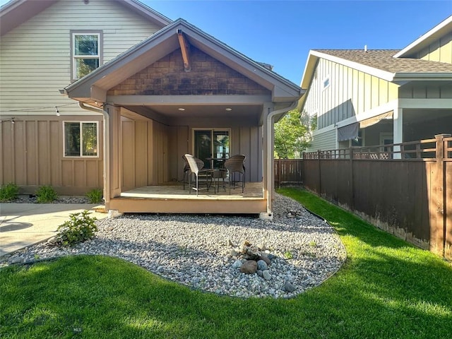 4442 Alexander, Bozeman, MT 59718 - rear view of house with board and batten siding, a wooden deck, and a shingled roof