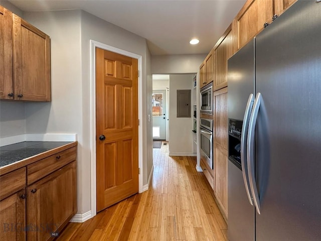 4442 Alexander, Bozeman, MT 59718 - kitchen with appliances with stainless steel finishes, brown cabinets, light wood-style flooring, recessed lighting, and baseboards