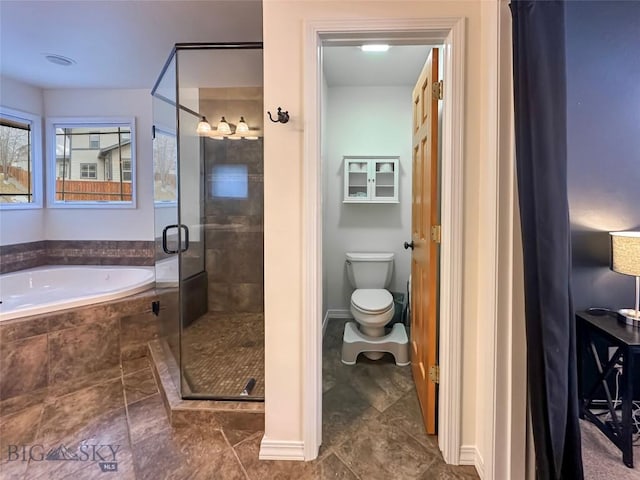 4442 Alexander, Bozeman, MT 59718 - full bath featuring a garden tub, a shower stall, toilet, and tile patterned flooring